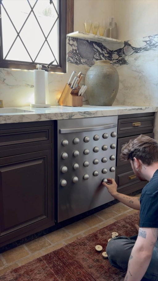 I had these leftover half wood balls from an art piece I made and figured with some silver spray paint they could add a unique texture to the dishwasher (plus the mini magnets make them super easy to remove)! 

I don’t think it’s ideal for my house but would be STUNNING in a mid century or more simple home (the copper wrapped one I had before was just perfect but sadly she had to be replaced. I’m thinking I’ll order another sheet of copper to potentially wrap this one too?!)