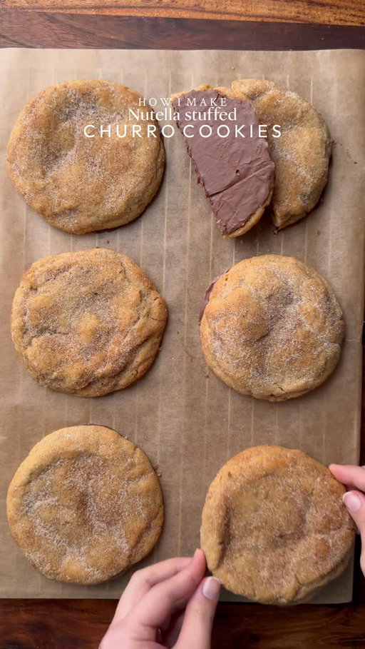 Nutella stuffed churro Cookie🤤

•Cut cling wrap into small squares. Scoop 1 tsp Nutella spread onto individual cling-wrap squares. Fold to seal and freeze until solid. (Repeat for however many stuffed cookies you plan to make.)
•In a large mixing bowl, add the cubed butter and whisk until slightly creamy. Add the white sugar and light brown sugar, then whisk together until well combined and fluffy.
•Add the eggs, vanilla extract and Whisk until fully incorporated.
•Add baking powder, baking soda, and salt and mix everything together and then in a separate bowl mix flour and cinnamon powder together and add it into the batter, gently mix until just combined, do not overmix.
•In a separate bowl mix cinnamon powder and sugar together and keep it aside.
•Portion the dough into 85-90gballs. Press a frozen nutella spread piece into the centre of each dough ball, seal well, and roll into a ball. Coat the dough ball with cinnamon sugar mixture and place it on a baking tray.
•Preheat fan oven to 175-180C (350°F). Bake for 10-15 minutes or until the tops are lightly golden while the centres remain soft.
•Remove from the oven and let it cool. At this point you can coat the cookie again with cinnamon sugar mixture.
•Now melt the chocolate bar using double broiler method and coat the bottom of each cookie with melted chocolate and keep it aside to set.
•Enjoy✨

NOTE: Store any extra dough balls in an airtight container or freezer bag and freeze for later. Whenever a cookie craving hits, bake straight from frozen🫶🏻

FULL RECIPE IS AVAILABLE ON:
Provecho.co/cookwithshaaa
LINK IS IN BIO🔗🤍

#cookie #churros #chocolate #nutella #dessert