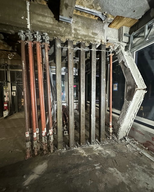 New York City's Department of Buildings (DOB) has released a new image showing the emergency works to stablise the 37-storey tower at 235 East 42nd Street after structural columns were seen buckling on its 21st floor.

In a statement on X the Department said: "Crews working through the night have made significant progress in stabilizing the impacted building at 235 East 42nd Street. DOB inspectors and engineers will remain on site to monitor the progress of work and continue their investigation into the structural failure."

New York City Buildings Commissioner Ahmed Tigani had reassured New Yorkers on Tuesday night that the building was stable.

Formerly the headquarters of pharmaceutical giant Pfizer, the building at 235 East 42nd Street had been undergoing renovation work to convert it from office space to more than 1,600 high-end apartments — including the addition of four new floors and the extension of several other levels.

Fire crews were called to reports of falling masonry at the site on Tuesday morning local time. A 'frozen-zone' was established from 40th to 45th Streets and from First to Third Avenues, which saw the area closed to vehicle and pedestrian traffic and buildings evacuated. 

The building renovation project, designed by Gensler for Metro Loft and David Werner Real Estate, had been due to complete in 2027. It's understood that the general contractor is 235 GC LLC with GACE as structural engineers.

📷 NYC Department of Buildings 

#engineering #construction #TheB1M #newyork #skyscraper
