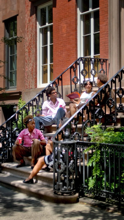 Catching up on the stoop with an ice-cold Coke. A classic American tradition.