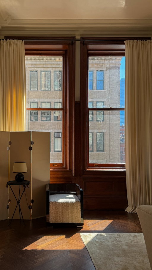 You never forget your firsts. The first time I stepped into this living room was also the first time I saw the soft light filtering through its grand-scale windows, and the first time I felt the history emanating from its wood-paneled walls. The room felt simultaneously empty yet full. In that moment, I vowed to be its steward, preserving its elegance while making it my own. 

Of all the rooms in our Tribeca home, the living room was the least interrupted. After a period of immersive self-study into early 20th-century design, a commitment to artisanship was paramount if I was to honor its beauty in this next iteration. But first, I needed to ground the design. With their bespoke approach to rug making, collaborating with @colbourns brought the level of craft, texture, and composition I was after. 

I loved designing this custom rug, utilizing their soft silk fibers to offer a plush, inviting feel underfoot, while the warm color and scale helped to anchor the room. Looking back, I realize that laying down the rug was another first—a moment when the room shifted from a beautiful space I had inherited to one that truly felt like home.