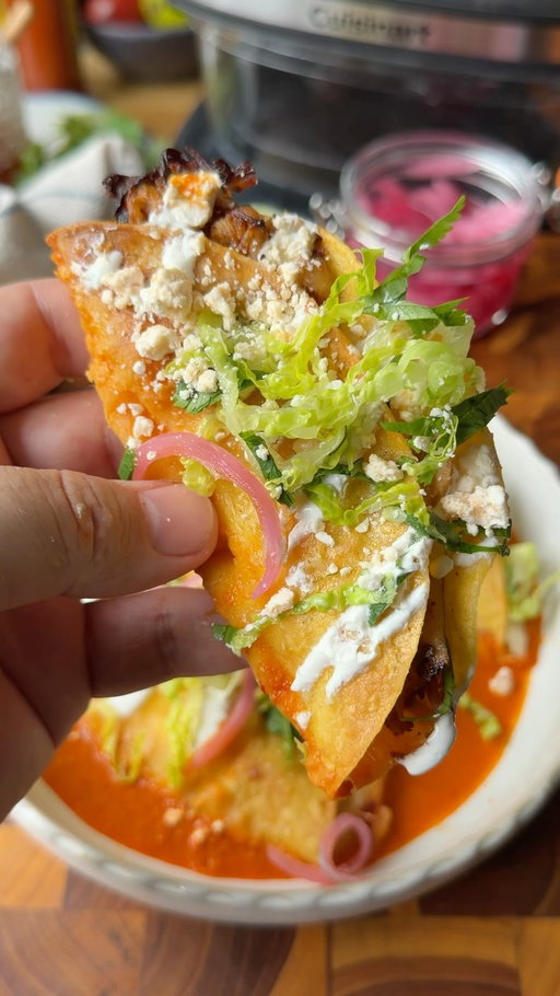 POV: You pull up to taco night with these Crispy Chicken Tacos Ahogados and now you’re forever in charge of dinner🫠🌮 

Spicy chicken thighs, melty Oaxaca cheese, crispy corn tortillas, and a bright, tangy guajillo salsa that brings the whole thing together🔥

The best part? I made the entire recipe right in the @cuisinart ClearView 4-qt Glass Basket Air Fryer- from roasting the chicken and veggies to crisping up the tacos until perfectly golden.

Save this one for your next easy weeknight dinner, and send it to someone you want to devour these with🤤 Shop on Amazon! 

Crispy Chicken Tacos Ahogados Makes 10-12 tacos
For the Chicken: 2 lbs boneless, skinless chicken thighs 2 tsp chili powder 1 tsp each smoked paprika, ground cumin, granulated garlic, onion powder, and Mexican oregano 1 1/2 tsp kosher salt 1/2 tsp black pepper 1 tbsp honey 1 tbsp avocado oil
For the Tacos: 10–12 yellow corn tortillas 1 lb Oaxaca cheese, shredded Avocado oil Guajillo Salsa 🌮 ( comment Tacos and I’ll send you the recipe🌶️

For Serving: Mexican crema, shredded lettuce, Cotija cheese, pickled red onions, fresh cilantro, and lime wedges

Instructions:
Soak the guajillo chiles in hot water until softened and set aside. Add the tomatoes, onion, and garlic to the ClearView Glass Basket and toss with avocado oil.

Season the chicken with the spices, honey, and avocado oil, then place it on the rack above the vegetables.

Air fry at 375°F for 18 minutes, or until the chicken reaches 165°F.

Blend the roasted vegetables with the softened guajillo chiles, spices, and lime until smooth.

Chop or shred the chicken, then fill the tortillas with Oaxaca cheese and chicken. Fold the tortillas, generously coat both sides with avocado oil, and air fry at 400°F for 6–8 minutes until crispy.

Top with your favorite ingredients and then drown them in that guajillo salsa🔥 Enjoy food fam!
#ad #Cuisinart #aworkofcuisinart