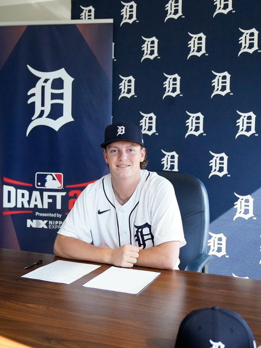 Signed with a smiley face
