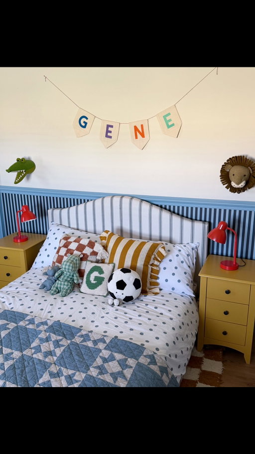 A D ⭐️ Time, please slow down😭 Gene is officially (and perhaps finally) out of a cot and into a bed, and what a bed it is 😍 Upholstered in the most beautiful striped material, it’s exactly what I’d always imagined for his first bed 🙌🏼 We found it at @argos, along with the bedding, bedside tables & the lamps. I think it might be the coolest little boys room ever 😉✨