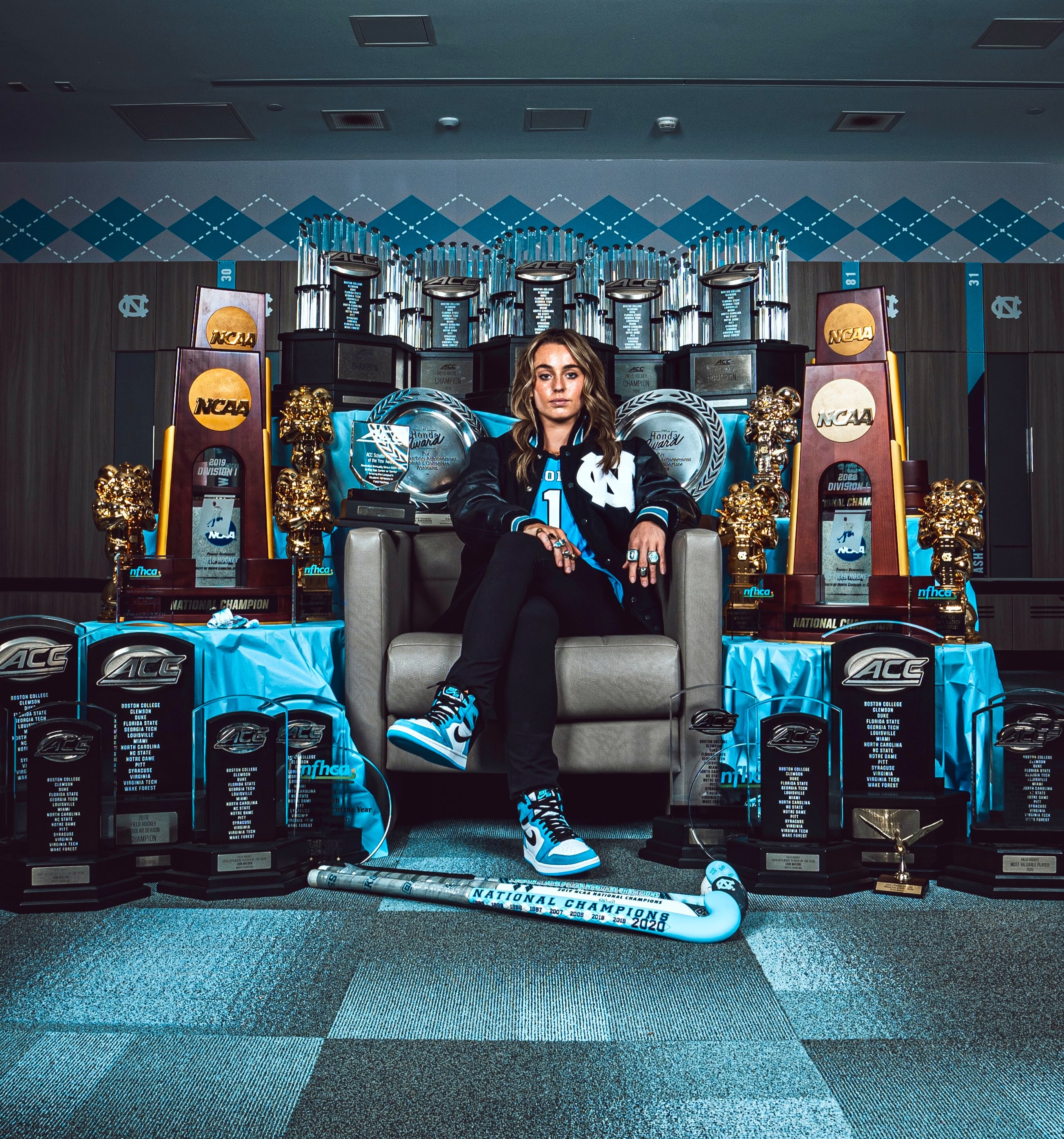 To celebrate “Erin Matson Week” on The Athlete Effect™ podcast, we’re hyped to exclusively share the story of this iconic portrait, captured in Dec 2022 by former UNC photog/videographer Jack Baddour.

By the end of her senior season in Chapel Hill, Erin’s trophy stash had piled up — 4 NCAA field hockey championships, 5 ACC titles, 5 All-America awards, multiple conference + NCAA tourney Most Outstanding Player designations, 3 Honda Player of the Year Awards, (There’s more, but you get the picture. Literally.) Erin’s dad, Brian, was mulling over ideas to celebrate his daughter’s achievements... and the portrait concept was born.

Brian and his wife, Jill, packed up the treasure trove amassed at their home outside of Philly, and made the 6.5 hour drive to Erin’s home away from home the last five seasons. They hand-picked Jack for this job— a rising sophomore, who’d already earned a reputation within Athletics as an ambitious young man, with a creative eye and humble energy. Jack spent nearly an hour meticulously bringing Brian and Jill’s vision to life inside the locker room at Karen Shelton Stadium: arranging the trophies and rings and custom Natty sticks, dressing the tables with Carolina Blue silks, getting the lighting just right, and positioning Erin as the scene’s centerpiece. “The hardest part,” Jack confessed, “was figuring out how to get all of Erin’s trophies into the frame — there were a lot of them.”

While the final image is spectacular, Jack was unable to capture one aspect of his subject that’s stuck with him, four years later. “Erin is so selfless,” he said. “Even though she understands she’s the reason we’re all here, she wants everyone to feel appreciated and acknowledged.”

Today, Jack is a PGA photographer who lists Scottie Scheffler, Rory McIlroy, and UNC alum Ben Griffin among his favorite players to shoot.

Right along with Erin Matson.

🎧 Listen to Erin’s convo (links in bio)
✅ Subscribe to our YouTube channel (thank you!)
👉 Follow on IG for content w badass execs + entrepreneurs + newsmakers using their athlete mindset to crush life after competition
📸 Check out Jack’s work on @jackbaddourphotography