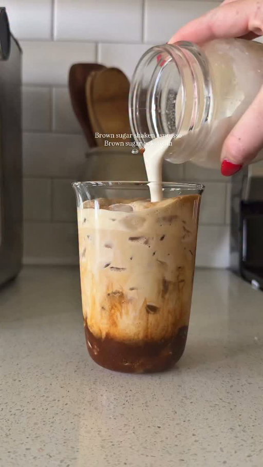 Brown sugar (frothed) not shaken espresso with brown sugar cold foam 🫶🏼🤎 @amoretti brown sugar syrup is to die for!! 

Recipe: 
2 shots espresso brewed over- 
1 tbsp brown sugar
pinch of salt
dash of cinnamon
1 tsp vanilla bean paste 

Add milk & ice 🧊 

Cold Foam: 
2 tbsp heavy cream
1-2 pumps brown sugar syrup 

#coffeeathome #CoffeeRecipe #coffeetiktok #shakenespresso