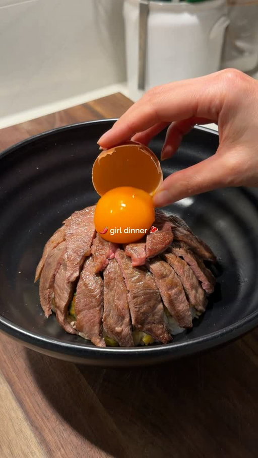 A Taiwanese Wagyu Beef Crack Bowl for girl dinner🌶️🥩

Was craving some of my childhood flavours so made some charred buttered rice hiding stir-fried pickled mustard greens, wagyu beef, an egg yolk, & flaky salt 🍚

CRACK BUTTER
50 grams unsalted butter, softened
1.5-2 tablespoons chili bean paste (doubanjiang)
2 tbsp coriander, finely chopped
1 garlic clove, grated
1/2 tsp salt

PICKLED MUSTARD GREENS
1 packet pickled mustard, chopped finely 
1 garlic clove, finely chopped
1 tbsp Shaoxing wine
1 tsp sugar
salt, to taste

WAGYU BEEF
1 packet wagyu yakiniku beef slices @ausmeatemporium 
salt 

1. Mix butter together & set aside.
2. Heat 1 tbsp neutral oil in a pan. Add garlic, pickled mustard greens, & stir-fry until fragrant. Deglaze with Shaoxing wine and season with sugar & salt. 
3. Heat a little oil in a pan. Season beef slices with salt and sear on high heat until caramelised, 1-1.5 minutes. Remove & rest.
4. Pack some cooked rice into a small bowl, pressing the mustard greens mixture into the centre so it’s hidden inside. Invert the small bowl into a larger serving bowl to release a neat mound of rice.
5. Generously spread the chili garlic butter over the top of the rice mound. Torch until the butter chars slightly and melts down over the rice.
6. Slice the rested beef and arrange over the charred buttery rice. Top with 1 egg yolk and finish with 1 pinch flaky sea salt, for finishing.

#girldinner #wagyu #ricebowl #dinneridea #asiancooking