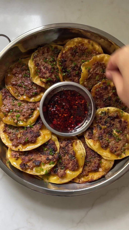 Easy no-fold dumplings: All the flavor, none of the fuss! ✨🥟 

INGREDIENTS
- 1 pound ground pork
- ½ cup chopped raw peeled tail-off shrimp
- ½ cup chopped leeks
- ½ cup chopped scallions
- 2 tablespoons soy sauce, plus more for serving
- 2 tablespoons dark soy sauce 
- 1 tablespoon oyster sauce
- 1 tablespoon chicken bouillon
- 2 teaspoons sugar
- 1 teaspoon black pepper
- 3 garlic cloves, finely minced
- 30 premade circular wonton wrappers
- 1 tablespoon high-smoke-point neutral cooking oil (such as vegetable oil)
- Chili oil, for serving
- Black vinegar, for serving

PREPARATION
1. Stir together the pork, shrimp, leeks, scallions, soy sauce, dark soy sauce, oyster sauce, bouillon, sugar, and black pepper in a large bowl.
2. Place 1 tablespoon of the pork filling on the center of 1 wonton wrapper. Using a spoon, smear the filling in an even layer across the face of the wrapper. Repeat with the remaining filling and wrappers.
3. Heat the oil in a large pan over medium-high heat until the oil shimmers. 
4. Working in batches of 3 or 4 dumplings (8–10 batches total), add the dumplings to the hot oil, and cook until the bottoms are crispy and slightly charred, about 2 minutes. Flip, and cook until the wrappers crisp up, about 1 minute. Repeat with the remaining dumplings. 
5. Serve with chili oil, black vinegar, and more soy sauce.
6. Enjoy!
