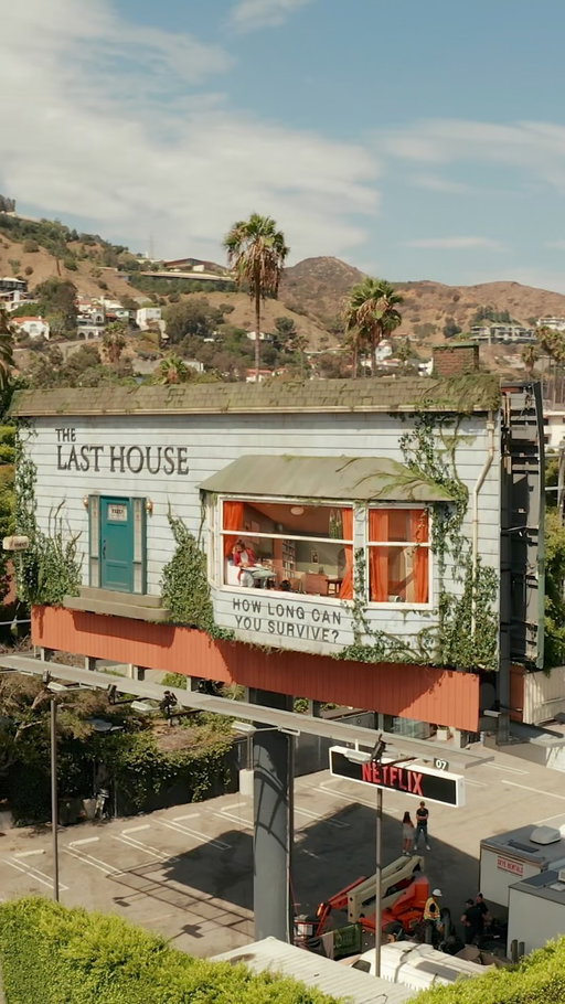 This is one of the wildest billboards in Los Angeles right now — and yes, that’s a real person inside.

Netflix has transformed a billboard above Sunset Boulevard into a fully furnished house, with a live performer staying inside and interacting with people below through the windows and a whiteboard. The activation is running August 6–8 and brings the premise of Netflix’s new sci-fi thriller The Last House into the real world. 

The movie follows a family that suddenly becomes mysteriously sealed inside their home, unable to escape as their resources begin to disappear and an unknown threat waits outside. The billboard recreates that feeling of being trapped — except this time, thousands of people driving down Sunset Boulevard can watch it happen in real life. 

📍 Sunset Boulevard, Hollywood
📅 August 6–8, 2026
🏠 Live performer inside the billboard
🎬 The Last House
📺 Now streaming on Netflix as of August 7

If you’re driving down Sunset Blvd., look up — this might be one of LA’s most creative movie promotions yet.