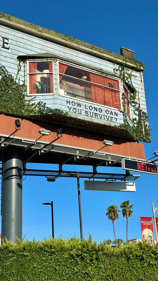 Say hi to the billboard guy living inside a billboard at Sunset and Selma. Nicknamed Billboard Bill, @n8ey is 'living' in the billboard to promote the Last House, a horror film about a family trapped in a house, out on Netflix. OG Jeff Olan, @jeffolancasting who lived in a Sunset strip billboard for 179 days in the 1980s, came out to say support. Bill held up a sign 'So Sick' then 'LEGEND' of respect.

The Last House stars Oscar nominee Wagner Moura and Greta Lee as parents whose family gets trapped in their Seattle home by a mysterious rainy force for more than 5 years. Very pandemic flashback vibes. 

#billboard #sunset #losangeles #lasthouse l