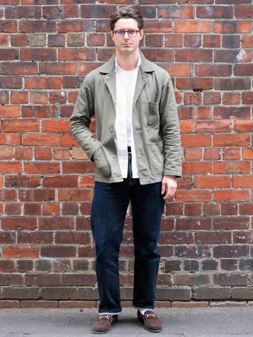 One Outfit For Life is a project asking the question; ‘If you could only wear one outfit for the rest of your life, what would it be?’ Here we speak with @stevecalder , Founder of Melbourne-based, casual tailoring brand @informale_ about his selection. 

If you could only wear one outfit, what would it be and why?

Chore jacket, casual shirt and nice jeans. The potential of each of these garments is massive, and when chosen right, would serve me from Sunday laziness all the way to a midweek evening event.

How does this collection of clothes allow you to move between the various aspects of your life?

My day-to-day is usually comprised of drives between workshops, office work, outings with my young family (puppy included), and seeing clients at our shop. I often wear this combo, so it would be really easy to just fill the wardrobe with these pieces and wear nothing else. 

What is the origin of this look for you?

My background since 15 years old is in tailoring. I wore and sold most of the menswear trends in the decade or so following, including early 2000’s sloppy fitting trash, mod-esque skinny fits and then the slick, luxe Italian side of tailoring. Luckily I finally found my own style which incorporates my taste in fabrics, cut and colour without any of the fussiness. As a business owner and dad, this type of get-dressed-in-the-dark, go-anywhere do-anything gear is exactly what I need to look and feel my best, whilst not needing to fuss about what I’m wearing.

How do you feel when you wear this? I feel like the most authentic version myself. Confident, relaxed, ready for anything.

List what you are wearing:

INFORMALE J043 Army Chore Jacket – Olive
INFORMALE SH25 Utility Shirt – White
INFORMALE TS03 T-Shirt – White
INFORMALE JE19 Jeans – Indigo
Bailey Nelson “Joyce” specs
1990’s @rolex Explorer II “Polar” watch
Ancien La Belle braided Suede Belt
@myrqvist Horsebit Suede Loafers