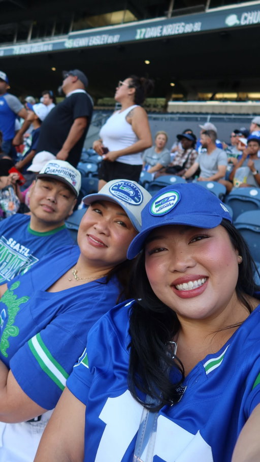 We are such a big @seahawks family so it is always so special to bring both of my parents to watch the Seahawks at @lumenfield! 🏈💚💙 Love training camp because it means football szn is starting up!!! 

Thank you @seahawks for the invite 🥹🏈 so excited for this season! ✨🫶🏼