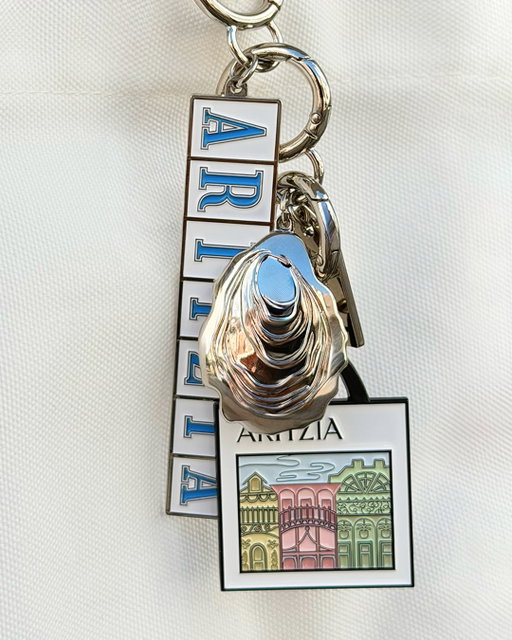 A little something for you — stop by the opening of our first-ever New Orleans boutique at Lakeside Shopping Center and pick up a bag charm with purchases over $150. It’ll be your souvenir.

We’ve also partnered with local favourite St. Pizza on limited-edition merch for a seasoned take on your favourite, Sweatfleece. Available with purchases over $400.

From August 13, 2026 - August 16, 2026, spend $150 USD or more and receive an Aritzia bag charm or spend $400 USD or more and receive an Aritzia Cozy Sweatfleece Perfect Crew. While supplies last. Limit one gift per customer. Available in-store only at Aritzia Lakeside Shopping Center. No substitutions or cash equivalent. Offer valid on qualifying pre-tax purchases.