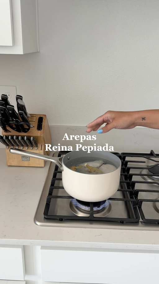 Arepas Reina Pepiada receta ⬇️🇻🇪

Ingredients

For boiling the chicken:

* 2 chicken breasts
* ½ onion
* 2 garlic cloves
* 1 bay leaf
* Salt, to taste
* Water

For the chicken filling:

* 2 ripe avocados
* ½ cup mayonnaise
* Juice of 1 lime
* Salt and black pepper, to taste

For the arepas:

* 2 cups pre-cooked white cornmeal, such as P.A.N.
* 2½ cups warm water
* 1 teaspoon salt
* ¼ cup crumbled feta cheese
* ¼ cup shredded mozzarella cheese
* Oil or butter, for cooking

1. Add the chicken breasts to a pot with onion, garlic, bay leaf, salt, and enough water to cover them. Boil until the chicken is fully cooked.
2. Remove the chicken, let it cool, and shred it.
3. In a bowl, mash the avocados. Add the mayo, lime juice, salt, and pepper. Mix in the shredded chicken and set aside.
4. For the arepas, mix the warm water and salt. Slowly add the cornmeal and mix with your hands.
5. Add the feta and mozzarella cheese. Mix again and let the dough rest for 5 minutes.
6. Shape the dough into arepas and place them in a lightly oiled pan. The trick is to cook them on low heat for 10 minutes on each side so they don’t burn and cook all the way through.
7. Cut them open, add the chicken filling, and enjoy!
•
•
•
•
@pan_us @caraway_home #venezuela #latinacontentcreator #arepas #reinapepiada #arepasvenezolanas