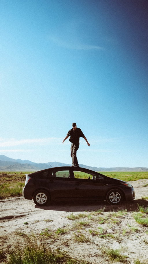 Ugly white car cuts off the best car ever made. The Toyota Prius.