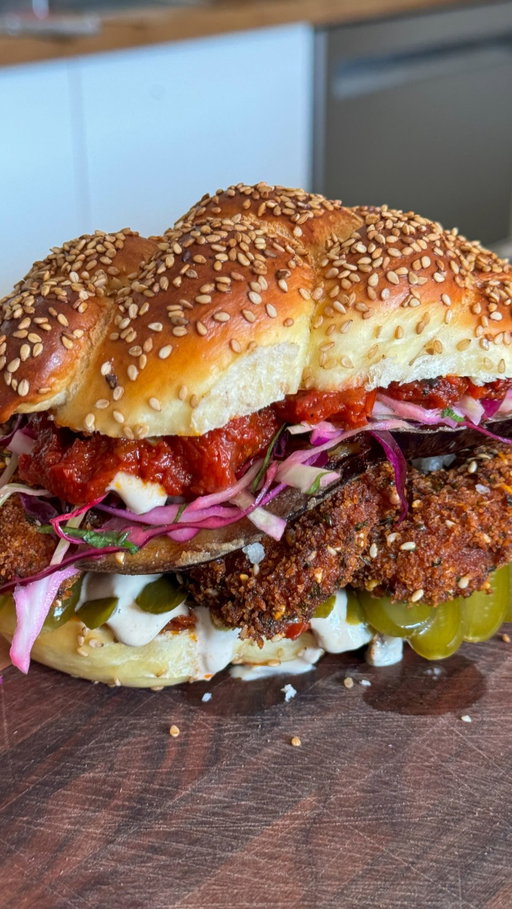 Fridays are for challah, schnitzel, and one seriously stacked sandwich!

Crispy schnitzel, fried eggplant, fresh salad, spicy matbucha, my grandpa’s pickles, and tahini, all packed into my homemade mini sesame challah.

Comment “FRIDAY” and I’ll send you the recipe!

YASSS!