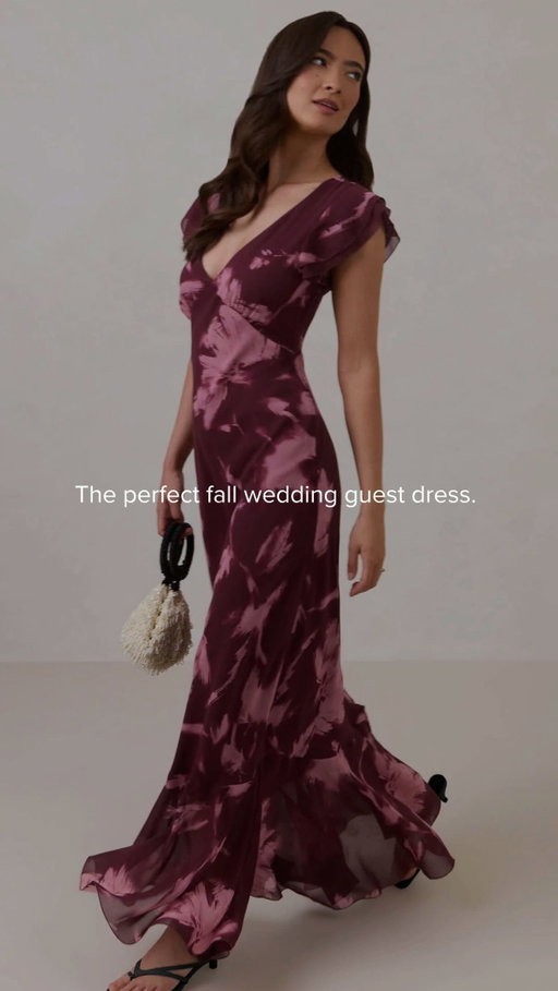 The fall wedding guest dress you’ve been waiting for 🍂✨ Introducing Clarke: deep V, flutter sleeves, and a rich berry-toned print that does all the talking.
