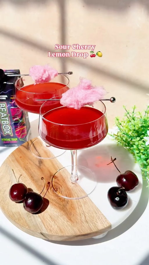 Bright, bursting with cherry flavor, and the perfect amount of sour. 🍒🍋

Our Sour Cherry Lemon Drop combines Xtreme Sour Black Cherry with fresh lemon for the perfect balance of sweet-and-sour 🍸

Ingredients:

- 1 oz simple syrup
- 2 oz lime juice 
- 4 oz Xtreme Sour Black Cherry 
- Sour Cherry cotton candy 

#BratBoxBeverages #BeatBox #cocktail #lemondrop #cherry