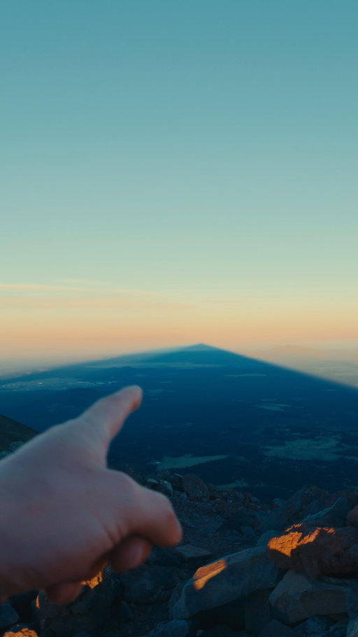 Watching Humphreys Peak cast its own shadow across Arizona as the sun came up. One of the coolest things I’ve seen from up here. #arizona