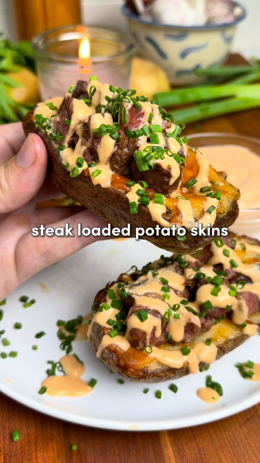 Steak Loaded Potato Skins🔥

Comment “Recipe” and I’ll send you the full recipe card for free!!

For those of you asking about the app, just search “Osta” on the App Store or Google Play 🫶

Crispy, cheesy potato skins loaded with juicy steak, chipotle sour cream & fresh chives… 🤤

Inspo from the goats @mikekubiesa & @burnt_pellet_bbq !!

For the Potatoes:
-5 large russet potatoes
-1/4 cup olive oil
-1 tbsp salt

For the Filling:
-Scooped potato flesh
-1/2 cup milk, warmed
-1/3 cup butter, softened
-1/2 cup sour cream
-1 1/2 cups sharp cheddar, grated
-1/4 cup fresh chives, chopped
-Seasoning salt, to taste

For Frying & Topping:
-Neutral oil, for frying
-Triple cheddar @tillamook, grated

For the Steak:
-Ribeye or New York strip
-Salt & black pepper

For the Chipotle Sour Cream (Optional):
-1 cup sour cream
-1–2 chipotle peppers in adobo
-2 garlic cloves
-1 tbsp lime juice
-1/2 tsp salt
-Milk, as needed

Instructions:

1. Wash & dry potatoes. Rub with olive oil, season with salt & bake at 425°F (220°C) for 50–60 mins until fork-tender. Let cool slightly.
2. Meanwhile, blend all chipotle sour cream ingredients until smooth, adding a splash of milk to thin as needed. Refrigerate.
3. Halve potatoes lengthwise & scoop the flesh into a bowl, leaving about 1/4 inch around the skins. Mash with warm milk, butter, sour cream, cheddar, chives & seasoning salt to taste.
4. Heat neutral oil to 350°F (175°C). Fry the empty skins in batches for 2–3 mins until golden & crispy, then transfer to a wire rack.
5. Stuff the skins with the potato filling, top with triple cheddar & bake at 350°F (175°C) for 15 mins until bubbling & golden.
6. Season steak generously with salt & pepper, then grill or pan-sear to your desired doneness. Rest 5–10 mins, then slice against the grain into bite-sized pieces.
7. Load the skins with steak, chipotle sour cream & fresh chives. Enjoy!!