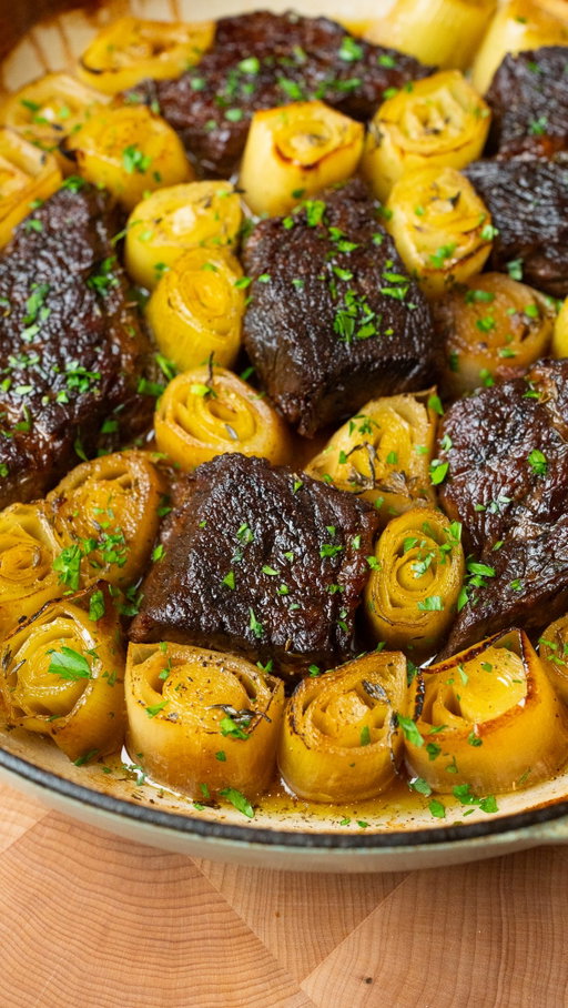 You’ve never had braised beef quite like this.

This braised chuck roast with leeks is one of my favorite Rosh Hashanah centerpieces. The leeks become soft and almost melt into the braising liquid, while the beef gets incredibly tender and full of flavor.

It’s festive, comforting, and one of those dishes my mom was always proud to bring to the table year after year.

Recipe below. Shana Tova Umetuka!

Braised Leeks & Chuck Roast

Ingredients
For the braised beef
3 lb chuck roast, cut into large 3-inch chunks
Kosher salt, to taste
Freshly ground black pepper, to taste
2 tbsp neutral oil, such as avocado oil
1-2 medium shallots, quartered
5-6 garlic cloves, peeled
⅓ cup dry white wine, such as Chardonnay
1 tsp whole black peppercorns
3 bay leaves
Small pinch ground turmeric, optional
Water, as needed
For the leeks
3-4 medium leeks
Kosher salt, to taste
Freshly ground black pepper, to taste
1 tsp fresh thyme leaves
About 1½ to 2 cups reserved braising liquid, plus more as needed
1-2 tbsp extra-virgin olive oil
For serving
Chopped fresh parsley, for garnish
Extra-virgin olive oil, for drizzling
Fresh thyme leaves, for garnish, optional
Crusty bread, for serving

Instructions in the comments.

**Quick note since I can’t edit the recipe comment: cut the leeks into about 1½-inch to 2-inch pieces rather than 2½ to 3 inches.**

#roshhashanahrecipes #braisedbeef #holidayrecipes #leekrecipes #yarindanieli 

braised chuck roast
braised leeks
Rosh Hashanah recipe
holiday beef recipe
beef and leeks