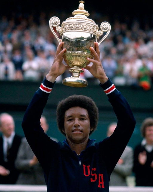 Arthur Ashe remains the first and only Black man to win the US Open singles title. 

When he won the inaugural US Open in 1968, his amateur status meant he couldn’t accept the $14,000 winner’s prize, receiving just a $28 per diem that totaled $280 for the tournament while the runner-up took home the top cash prize. 

Ashe went on to win 33 career singles titles, including Wimbledon in 1975 and the Australian Open in 1970, earning the world No. 1 ranking. In 1997, the United States Tennis Association honored his immense contributions to the sport by naming the main stadium at Flushing Meadows after him.

Off the court, Ashe used his voice to fight social injustice, receiving a personal letter from Dr. Martin Luther King Jr. during his college years at UCLA encouraging his role as an athlete and activist. He was arrested during civil rights protests outside the White House against the treatment of Haitian refugees and at the South African Embassy protesting apartheid. His advocacy contributed to his meeting with Nelson Mandela in 1990, where Mandela told Ashe that his activism had provided strength during his years on Robben Island.

Later in life, after contracting HIV from a blood transfusion during heart bypass surgery, Ashe turned his diagnosis into public advocacy, establishing the Arthur Ashe Foundation for the Defeat of AIDS to combat the stigma surrounding the disease.

Today, his legacy remains tied to the tournament where he made history. Frances Tiafoe and Ben Shelton face each other on Arthur Ashe Stadium in the US Open semifinals, battling for a spot in the final as they both look to become the first Black American man to win the tournament’s singles title since Ashe.