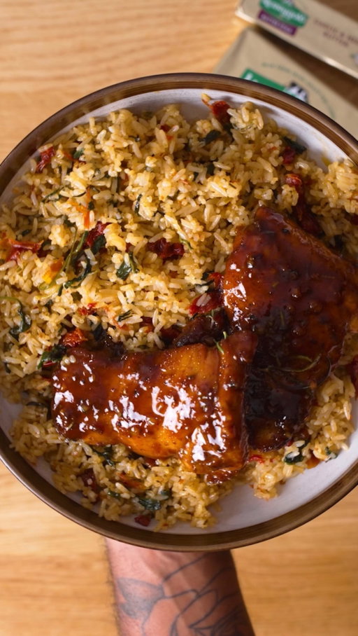 #ad This sticky apple cider glazed chicken with garlic butter sundried tomato & spinach rice is the perfect cozy weeknight dinner you need, made with @kerrygoldusa Recipe below.

Chicken 
1 ½ pounds boneless, skinless chicken thighs
kosher salt and pepper
½ tbsp teaspoon smoked paprika
½ tbsp garlic powder 
½ tsp Chinese 5 spice powder 
½ tbsp fresh grated ginger 
½ tbsp Italian seasoning 
2 tbsp olive oil 
4 tbsp KerryGold Salted Irish Butter
2 rosemary sprigs 
Sticky Apple Cider Glaze 

4 tbsp KerryGold Salted Irish Butter, divided 
4 garlic cloves, minced 
¼ cup Honey 
 1 cup apple cider
½  tbsp Dijon mustard 
1 tbsp Apple cider vinegar 

RICE 
3 cups cooked jasmine rice, preferably chilled or room temp
3 tbsp Kerrygold Garlic & Herb Butter
⅓–½ cup sun-dried tomatoes, drained 
2 cups packed fresh baby spinach, rough chopped 
Salt, only if needed to taste 
1 tsp Chicken bullion powder 

INSTRUCTIONS 
1. Season chicken thighs with smoked paprika, garlic powder, chinese five spice, fresh ginger, italian seasoning, salt, pepper olive oil and mix well until every piece of chicken is coated well. 
2.Next add 2 tbsp of oil to a pan on medium high heat and sear each piece of chicken until it is charred. 
3.To the pan add 4tbsp Kerrygold butter and fresh rosemary and start basting the chicken thighs.
4.Remove and add in 2 more tbsp of KerryGold Butter then go in with minced garlic saute for 1 minute then Deglaze with apple cider, scraping up all that goodness.
5.Add honey + Dijon + small splash apple cider vinegar.
6.Reduce over medium/medium-low until it becomes noticeably syrupy. Remember it’ll thicken more as it cools.
7.Lower the heat or take the pan off the heat, then whisk/swirl in another 2 tbsp Kerrygold butter. Now you’ve got that glossy, buttery apple-cider pan sauce. Add your chicken back, turn it around in the glaze and spoon/baste the sauce all over it
8.Melt Kerrygold Garlic & Herb Butter in a skillet.
9.Sauté sun-dried tomatoes and spinach.
10.Toss in cooked jasmine rice.
11.Season to taste and enjoy!
