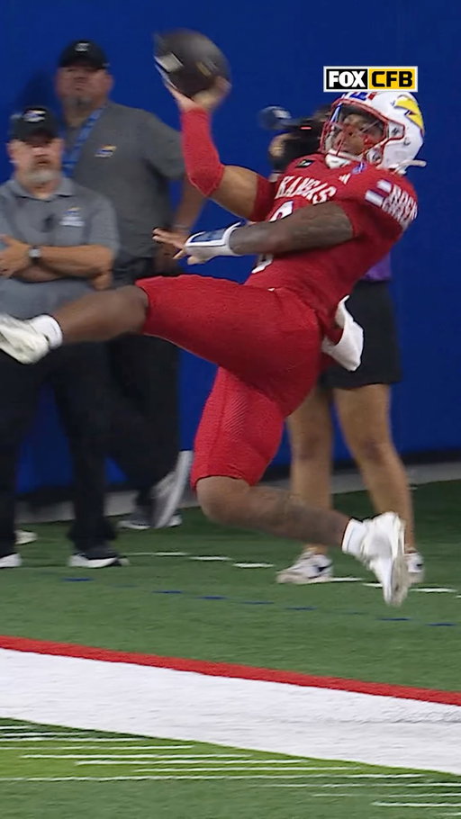 Isaiah Marshall SOMEHOW gets this throw off 😳

What a play for @kufootball!