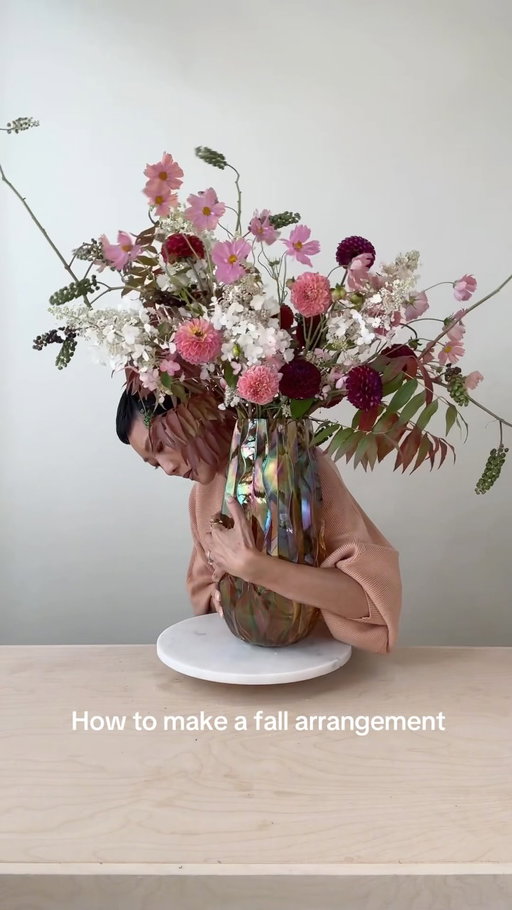Recipe for this arrangement:
✔️ Poke berry 1-2 branches 
✔️ Lace cap hydrangeas 5 stems
✔️ Pistachio foliages 1-2 branches
✔️ Dahlias burgundy and coral 12-15 stems 
✔️Cosmos 8-10 stems 🌸 The flower Cosmo 🐶 is named after
✔️ Flower food: a splash of sprite and a few drops of bleach
✔️ Follow for more flower arranging.
