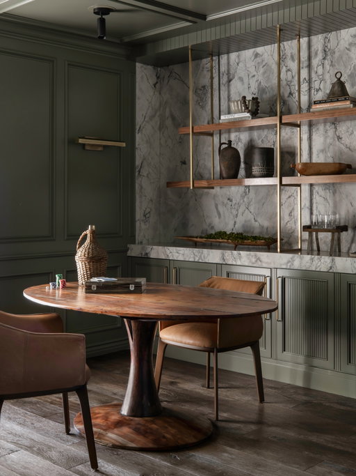 A room that works hard without feeling like it. We designed this space to move seamlessly between functions - a home office by day and a place to gather, play a game or pour a drink when the work is done. Moody green walls, beautifully veined stone, warm walnut and aged brass give it that collected, lived-in feeling I’m always drawn to. This room is proof that the most functional spaces can still have plenty of soul.

Photos by @public311design