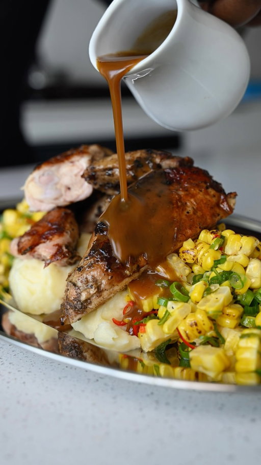 Jerk Cornish hens with buttery mashed potatoes, charred corn salsa & pan gravy. Big flavour, simple ingredients, and one hell of a dinner.

Jerk Cornish Hens
3 Cornish hens
Jerk marinade
Neutral oil
Lime + vinegar

Charred Corn Salsa
3 ears corn
2 green onions
2 bird’s eye chilies
1 lime
Olive oil
Salt + pepper

Mashed Potatoes
3 Yukon Gold potatoes
Butter
Heavy cream
Salt

Pan Gravy
½ cup chicken stock
Butter

Method
Spatchcock and clean the hens with lime, vinegar and water. Rinse, pat dry, coat generously with jerk marinade and refrigerate at least 4 hours, preferably overnight.

Heat a large cast iron with neutral oil. Sear hens skin-side down, weigh them down, then roast at 425°F for 30–35 minutes or until cooked through.

Boil corn until tender, season with oil, salt and pepper, then grill or char. Cut from the cob and toss with green onion, bird’s eye chili, lime zest, lime juice and olive oil.

Boil potatoes in salted water until tender. Rice, then mix with melted butter, warm cream and salt.

Remove hens from the pan. Add chicken stock to the fond, scrape well and simmer. Stir in a knob of butter and strain.

Plate it all up and don’t forget that gravy.

#easyrecipes #asmr  #cornishhen #cheapeats