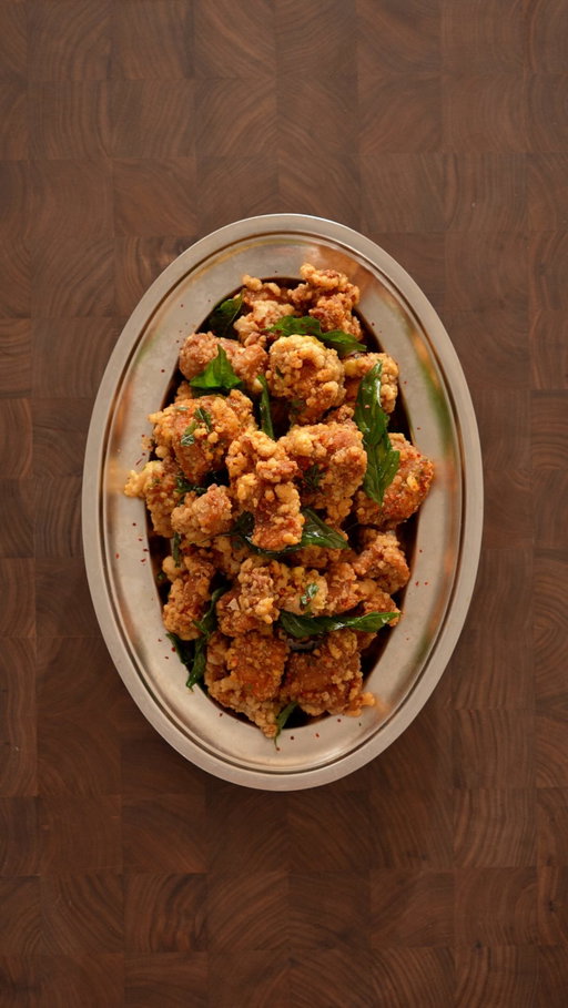 Taiwanese Popcorn Chicken 🐓

Ingredients

Fried Chicken
- 6 chicken thighs, cut into 1-inch pieces
- 6 cloves garlic, minced
- 2 cups tapioca flour
- 1½ tbsp grated ginger
- 3 tbsp soy sauce
- 2 tsp sesame oil
- 2 tsp sugar
- 2 tsp five-spice powder
- 1 tsp white pepper
- 1 tsp salt
- Frying oil

Sauce
- 3 tbsp mayonnaise
- 1 tbsp Sriracha
- A few drops of sesame oil
- ½ tsp five-spice powder
- ½ tsp rice vinegar or vinegar

Chicken Seasoning 
- Chilli flakes
- Salt

Instructions

Fried Chicken
- Chop the chicken thighs into 1-inch pieces and add them to a bowl with soy sauce, sesame oil, sugar, five-spice, white pepper, salt, grated ginger, and grated garlic. Mix well and let marinate in the fridge for at least 30 minutes.
- Coat the marinated chicken in tapioca flour.
- Deep-fry at 350°F for 5–7 minutes, or until golden brown and cooked through.
- Season with chilli flakes and salt.

Sauce
- Combine mayonnaise, sriracha, sesame oil, rice vinegar, and five-spice. Mix well.