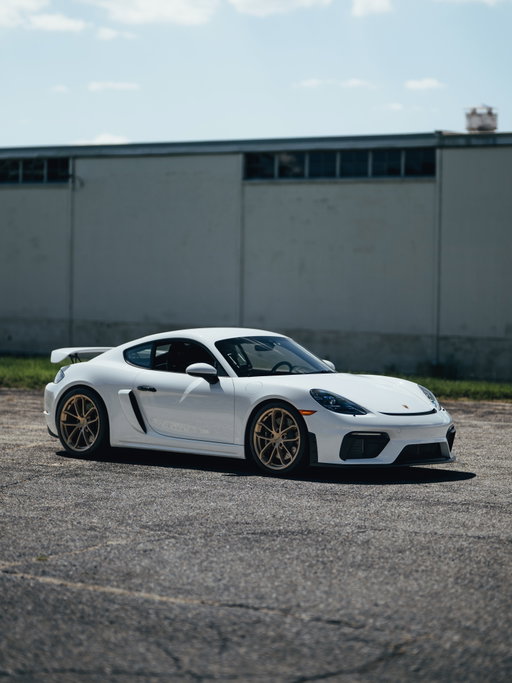 The fixed rear wing is only part of what separates the 718 Cayman GT4. Its 4.0 liter naturally aspirated flat six produces 414 horsepower and revs to 8,000 rpm, while the GT chassis sits 30 mm lower and uses ball jointed connections for greater precision. This one pairs White paint with 20 inch Satin Platinum GT4 wheels and PDK. 

#Porsche #718Cayman #CaymanGT4 #GT4 #PorscheDelaware