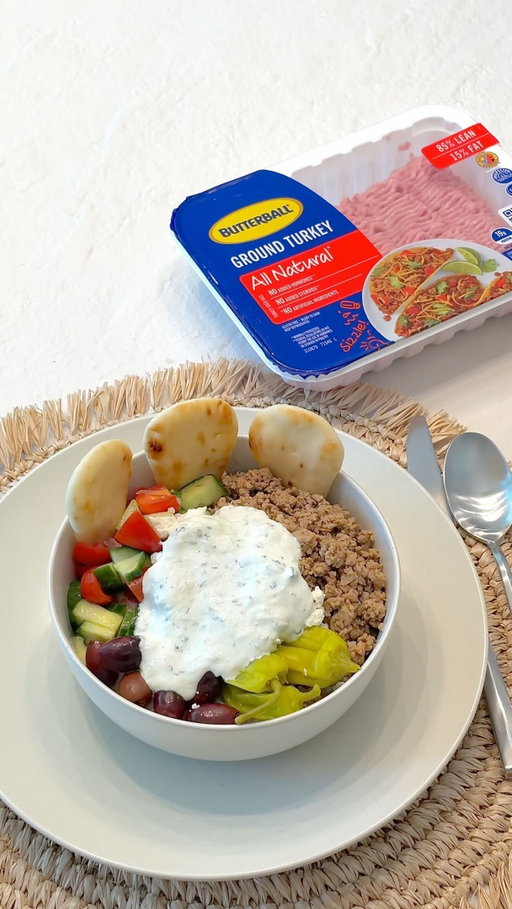 #ButterballPartner @butterballturkey Ground Turkey Gyro Bowls ⬇️ RECIPE ⬇️ These will be your new addition to the weekly rotation.

Tzatziki:
1/2 cup English cucumber, grated
2 cloves garlic, finely chopped
1 cup Greek yogurt
1/3 cup fresh mint, chopped
1/3 tsp kosher salt

In a medium bowl, toss grated cucumber, garlic, yogurt, mint, and salt until combined. Set aside.

Cucumber Salad:
2 English cucumbers, chopped 
1/2 small red onion, finely chopped
1 cup cherry tomatoes, quartered 
2 tsp olive oil
1/2 tsp kosher salt

In a large bowl, toss cucumbers, onion, tomatoes, oil, and salt until combined. Set aside.

Turkey and Assembly:
1 tbsp olive oil
1/2 small red onion, chopped
1 lb ground turkey
2 cloves garlic, chopped
1 tbsp dried oregano
2 tsp smoked paprika
1 tsp kosher salt
freshly ground black pepper (to taste)
Rice, for serving 
Peperoncini, for serving
Kalamata Olives, for serving
Feta Cheese, for serving 
Naan Dippers, for serving

In a pan over medium heat, heat oil. Add onions and cook for 3-5 minutes. Add turkey, garlic, oregano, paprika, salt, and pepper and cook until turkey is no longer pink, 6 to 8 minutes.

Divide rice, turkey, and cucumber salad among bowls. Top with toppings and a dollop of tzatziki. Enjoy!