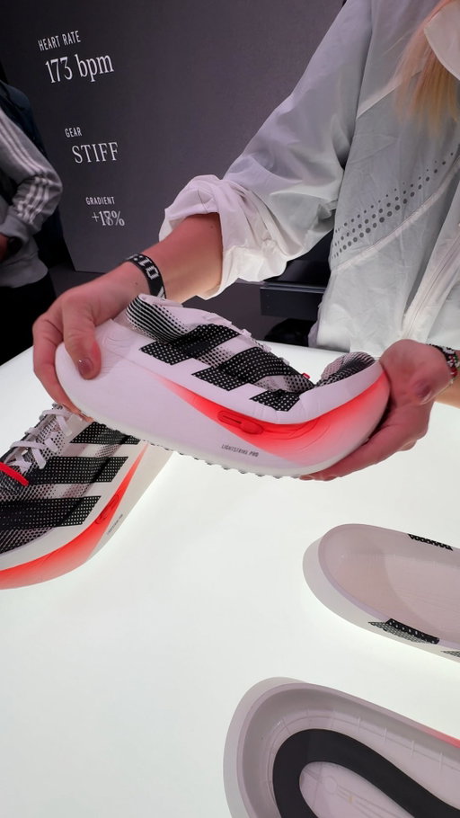 @adidas athletes took all six podium spots at the Berlin Marathon today, all racing in the Adizero Adios Pro Evo 3. So what comes after a record-breaking shoe?

Inside the adidas Innovation Lab, we got an early look at the Adizero Gearshift: a concept shoe that shifts its bending stiffness in real time, like changing gears on a bike. Instead of one static setting for an entire run, athletes can change how the shoe performs as their run progresses, switching between a stiff “attack” mode and a softer “cruise” mode.

It’s being developed as two solutions. The mechanical version shifts with a push and slide of a button on the shoe and the electronic version connects to a watch. Both are in testing with adidas athletes, whose feedback on details like how quickly they can shift, weatherproofing, and GPS integration is shaping what comes next.