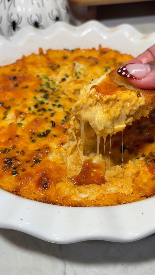 #Ad Game day calls for something a little spicy 🔥🦀 This Buffalo Crab Dip is creamy, cheesy, loaded with crab, and made with @franksredhot Buffalo Wing Sauce for just the right amount of heat. Literally the perfect appetizer for your game day.

Ingredients:

1 lb lump crab meat
1 (8 oz) block cream cheese, softened
½ cup Frank’s RedHot Buffalo Sauce
1 tbsp French’s Dijon mustard

1 cup shredded cheddar cheese, divided
1 cup shredded mozzarella cheese, divided
2 green onions, thinly sliced
2 cloves garlic, minced
1 tbsp lemon juice
½ tsp paprika
½ tsp onion powder
½ tsp garlic powder
Salt & black pepper, to taste
Chives, for topping
1 baguette
1 tbs olive oil
Directions

In a large bowl, mix the softened cream cheese, Buffalo sauce, French’s Dijon mustard, lemon juice, garlic, paprika, onion powder, garlic powder, salt, and pepper until smooth.

Fold in the lump crab meat, sliced green onions, 1/2 cup cheddar, and 1/2 cup mozzarella. Mix gently so you don’t break up the crab too much.

Transfer to a baking dish and smooth out the top.

Sprinkle the remaining 1/2 cup of cheddar & 1/2 cup of mozzarella over the top.

Bake at 375°F for 20-25 minutes until hot and bubbling. Broil for 1–2 minutes if you want that golden cheesy top.

Finish with fresh chives and serve hot with toasted baguette or crostini.

Slice the baguette into thin rounds, arrange on a baking sheet, and brush lightly with olive oil. Bake at 400°F for 8-10 minutes , until golden and crisp.

Serve the warm Buffalo crab dip with the baguette crostini.

#FranksRedHotPartner #BuffaloCrabDip#GameDayAppetizer #GameDayRecipes