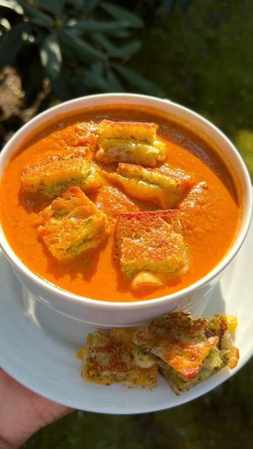 Warm up with this classic Tomato Soup and Pesto Grilled Cheese bites made with @tillamook . The Sharp Cheddar and Swiss Farmstyle Slices deliver melted perfection and bold flavor in every bite! #TillamookPartner