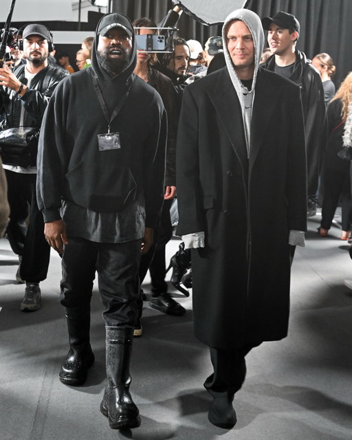 4 years ago today, Ye made his modeling debut at Paris Fashion Week👇

Ye started the day at Balenciaga’s show in Villepinte, where he walked a mud-filled runway for the very first time, dressed in a full military style look complete with a “security” patch and a Balenciaga branded mouthguard. His appearance wasn’t announced beforehand and wasn’t acknowledged during the show itself. All four of his kids, North, Saint, Chicago, and Psalm, were there to watch, with North sitting front row alongside her aunts Khloé Kardashian and Kylie Jenner

Balenciaga’s creative director Demna described the muddy, war torn set as “a metaphor for digging for truth and being down to earth.” Later that same day, Ye was spotted front row at the Givenchy show, alongside designer Matthew Williams, who had been serving as the house’s artistic director since 2020

One thing I found cool about this day was Ye switching hats as he arrived. As he pulls up in his all black Suburban, you can see the Martine Rose cap tucked in his pocket while he’s wearing his Balenciaga cap. The second he steps out of the car, he’s already got the Martine Rose cap on instead. Then once he walks inside the building, he switches right back to Balenciaga. It’s a small thing, but it shows just how calculated every single moment is for Ye

Looking back, it was a packed day of fashion for Ye, going from his own runway debut to the front row at one of Paris’s biggest houses, all within the same afternoon.