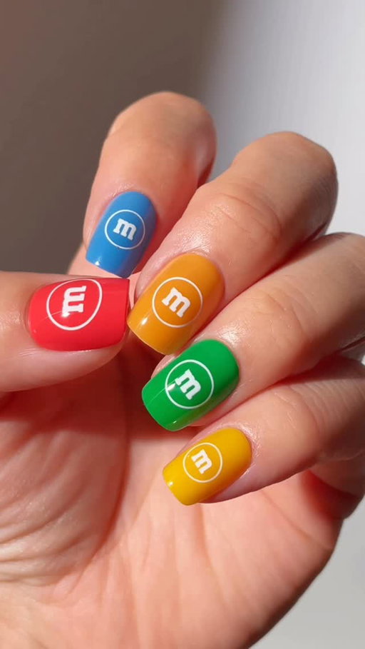 Trick or treat? Treat. @ellzabethm is wearing our new Sticking Point look, Yummazing, from our OPI x @mmschocolate collab.