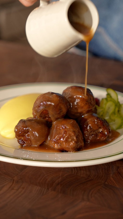 Who wants a full plate of Swedish meatballs? 🇸🇪

Had these at a restaurant in Sweden and I think they’re pretty close!

Ingredients

Meatballs
- 500g minced beef
- 500g minced pork
- 3/4 cups panko breadcrumbs
- 1 large egg
- 2 tbsp olive oil
- 1/4 cup heavy cream
- 2 TBSP milk
- 1 TBSP dijon mustard
- 1 tsp allspice
- 1 tsp black pepper
- Salt
- Butter
- Olive oil
- Herbs: Thyme and rosemary

Gravy 
- 1 cup heavy cream
- 2 cups beef stock
- 1 tsp Dijon mustard

Mashed Potatoes (Pomme purée):
- 5 Yukon potatoes
- 1 cup unsalted butter
- 1 cup whole milk
- 1–2 tsp salt

Cranberry Sauce
- 2 cups lingonberries (I used cranberries because I couldn’t find lingonberries)
- 1/3 cup sugar
- Lemon juice to taste
- Salt

Quick Pickles
- 1 cucumber
- 2 cups white wine vinegar
- 1 cup water
- 3/4 cup sugar
- 1 tbsp mustard seeds
- Dill

Instructions

Meatballs
- Add panko breadcrumbs to a bowl with heavy cream, milk, a whole egg, and Dijon mustard. Mix and let sit for 5 minutes.
- Add ground beef, ground pork, allspice, salt, and black pepper, then mix until well combined. Form into golf-ball-sized meatballs and chill in the fridge for 1 hour.
- Sear the meatballs in a pan with olive oil. Butter baste with herbs until fully cooked, then remove the meatballs from the pan.

Gravy
- In the same pan, reduce the beef stock with heavy cream. Once reduced, add Dijon mustard and whisk to make the gravy.
- Warm the meatballs in the gravy before serving.

Mashed Potatoes (Pomme Purée)
- Boil the potatoes from cold water for about 35 minutes, or until tender. Peel the potatoes while warm, then pass them through a sieve.
- Add the potatoes to a pan over low heat and gradually fold in the butter until creamy.
- Pour in the milk and season with salt and gently fold.

Cranberry Sauce
- Cook the lingonberries in a pan over medium heat with sugar and lemon juice until they reach a jam-like consistency. Do not squish the lingonberries so they retain their shape.

Quick Pickles
- In a saucepan over low heat, cook the sugar with white wine vinegar, water, and mustard seeds until the sugar dissolves.
- Add the sliced cucumbers and dill, then transfer to a container.