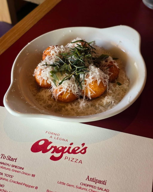 🎉 Congratulations to Angie’s Pizza on being named one of the new Michelin Guide Recommended restaurants in the 2026 guide! ⭐ The designation recognizes restaurants selected by Michelin’s anonymous inspectors, joining nine new Houston recommendations without carrying a Star or Bib Gourmand distinction. 

🍕 For Houston native Angelo Emiliani, the honor adds another chapter to a pizza project that has been six years in the making. Angie’s began as a pandemic-era Los Angeles pop-up before Emiliani brought it home, drawing on experience working alongside acclaimed pizzaiolo Chris Bianco and years of Houston pop-ups before opening its permanent Heights home in July with pastry chef and co-owner Luciana “Louie” Emiliani. Wood-fired pizzas remain the centerpiece, joined by handmade pastas, seasonal dishes and desserts.

🔥 Just over two months after opening, Angie’s remains one of the hottest tickets in town, drawing crowds and booking well in advance. We’ve had luck dropping in at or just before opening, while @BarAngieHTX upstairs typically has seats available during non-peak hours.

🍸 The bar is well worth checking out and adds another dimension to the restaurant with a cocktail program from Drew Bennett, formerly of Anvil. The menu leans into Italian-inspired cocktails, aperitivo and wine, giving Angie’s a second destination above the pizza counter.

📍 @AngiesPizzaPies, 1002 West 11th
✍️🏽 @MadmanMario