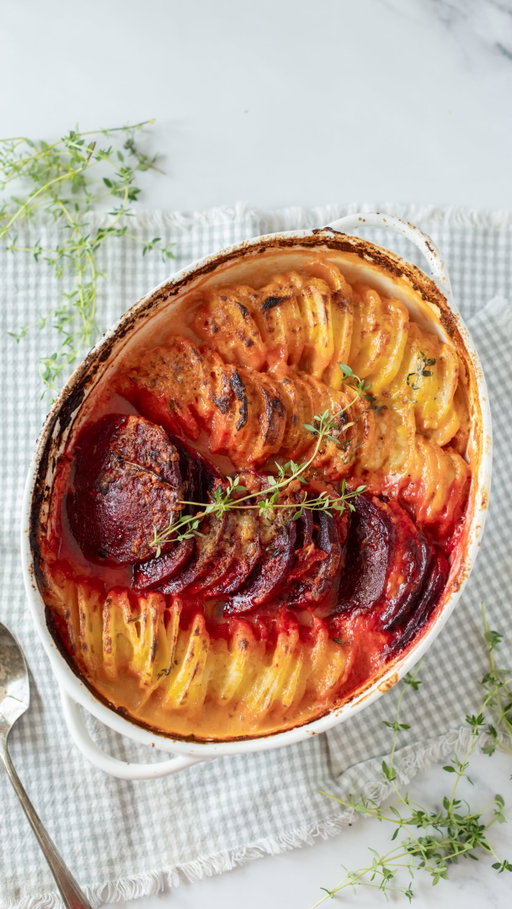 Your Thanksgiving table called. It wants this gorgeous, cheesy situation. ❤️💜 Follow @fraichetable and comment GRATIN for the recipe!
 This healthier gratin skips the traditional cream and layers russet potatoes, sweet potatoes, and beets in a garlicky béchamel, then tops it all off with a blanket of bubbly, golden Gruyère. The beets turn every layer a jewel-toned pink, so it truly steals the show on any table. Almost too pretty to eat. Almost. 
As a dietitian, I fully support any situation where vegetables are the most popular thing on the table. As someone who loves cheese, I fully support this whole Gruyère situation. 
Fair warning: the turkey may have some competition this year. 🦃