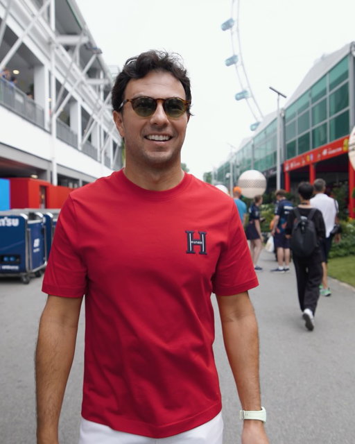 Making the paddock his runway. Checo Pérez wearing the Tommy Varsity T-shirt at the Marina Bay Street Circuit in Singapore. 

@schecoperez @cadillacf1