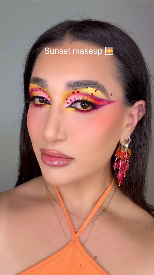 ✨🏵️🌺🌅SUNSET MAKEUP 🌅🌺🏵️✨

I am absolutely in love this these colors! As Zara Larsson once said “SUMMER ISN’T OVER YET 🎶”. In all seriousness please enjoy this sunset makeup look while I cook up some Halloween looks 🤭 

PRODUCT DETAILS 👉🏼

FACE
🌅 @danessa_myricks Yummy Skin Blurring Balm Powder
🌺 @rhode Glazing Milk 
🏵️ @anua_global PDRN Hyaluronic Acid Mist
✨ @morphebrushes Peptide Bronzing Serum 
🌅 @charlottetilbury Airbrush Flawless Blur Concealer
🌺 @benefitcosmetics The POREfessional foundation 
🏵️ @milkmakeup Matte Bronze Stick (Baked)
✨ @juviasplace Blushed Liquid Tints (Coral Sunset & Flamingo Rose) & Blushed Duo (Vol 6)
🌅 @kimchichicbeauty Puff Puff Pass Loose Setting Powder *USE CODE “LEXILALAMAKEUP15” FOR 💰 OFF
🌺 @maccosmetics Matte Sunstruck Bronze (Light Golden)
🏵️ @hardcandy Blue on Lock Setting Powder (Translucent Pink)
✨ @wetnwildbeauty Chameleon Chrome Highlighter (Soft Ember)

BROWS
🌅 @rarebeauty Brow Harmony Brow Gel
🌺 @nyxcosmetics Blade & Shade Eyebrow Pencil 

EYES
🌅 @bellabeautebar Arch of Color Eyeshadow Palette *USE CODE “Lexilalamakeup” FOR 💰 OFF
🌺 @maccosmetics Paintstick Pro Palette 
🏵️ @colourpopcosmetics Creme Gel Eyeliner (Punch)
✨ @urbandecaycosmetics 24/7 Inks Easy Liquid Eyeliner Pen (Zero)

GLITTER/SPARKlE
🌅 @jelliwinkcosmetics Prismatic Pigment (Imogen)
🌺 @sheglam_official Go Go Glow Highlighting Mist (Love Bomb)

LIPS
🌅 @morphebrushes Signature Lip Pencil (Dearest) 
🌺 @kaleidosmakeup Glassload Lip Melt (Clean Slate) 
🏵️ @colourpopcosmetics X Hannah Montana Shimmer Lip Gloss (Secret Superstar) 

Makeup, Makeup trends, Halloween, Sunset makeup, Orange, Colorful makeup, Makeup inspo, Glam, Rhinestones