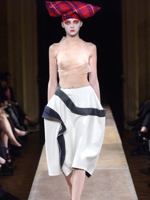 Flashback Friday: A look back at archival fashion shows on Vogue Runway. 

Predating Prada’s skirt-centric show by more than 20 years is Rei Kawakubo’s spring 2004 Comme des Garçons collection. “Technically speaking, there was only one garment in Rei Kawakubo’s collection: a skirt,” reported Sarah Mower at the time. “Apart from the stocking tops used to veil the breasts from complete nudity, and the horned cloth headdresses, she showed nothing else. Not even any shoes.” Jackets, Mower was assured, were available to see in the showroom, but evidently they interfered with the designer’s focus on “designing from shapeless, abstract, intangible forms, not taking into account the body.” Tap the link in bio to see all the looks.