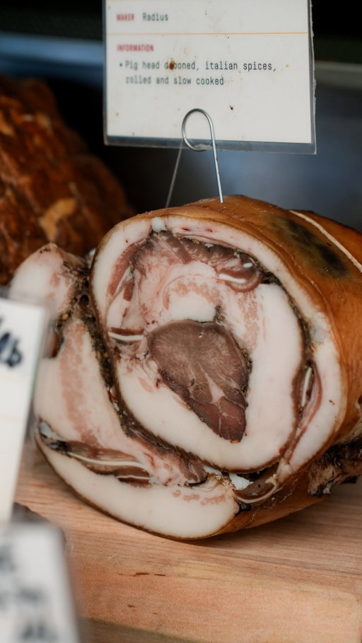 Everything in our charcuterie case is made in-house from whole animals we break down — 3 different types of bacon, mortadella, guanciale, pâté, and more.