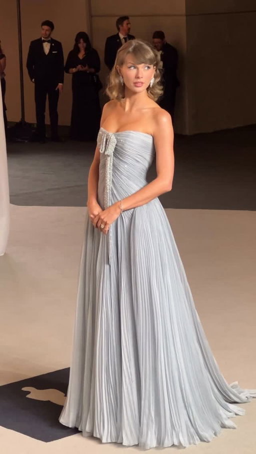 Her presence is the present. @taylorswift arrived at tonight’s Academy Museum Gala in custom @dior, complete with a shimmering bow. Tap the link in our bio to see all of tonight’s arrivals.