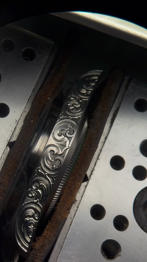 Cutting the case side of “Moby Dick” project.
This is one of the new generation designs with changes into fine detail such as - new shading geometry (how light is traped and reflected), black polish cuts on sidewalls (more light play in all conditions) and others.
As this is stainless steel with deep relief engraving - gray backgrounds without any paint have been peoples favorite to bring out the contrast even more, yet still show all of the surfaces and tool marks with no paint used.

#watches #indieartist #artcollection #handengraved #artwork
