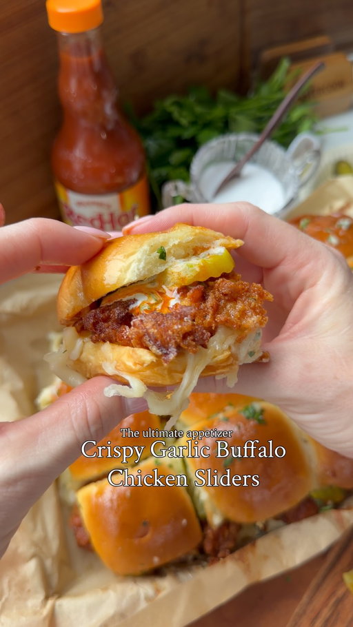 Crispy Garlic Buffalo Chicken Sliders with Frank’s RedHot Buffalo Wings Sauce

#ad Crispy chicken tossed in a garlicky Frank’s RedHot Buffalo Wings Sauce and piled onto soft slider rolls. These are packed with flavor and make the perfect appetizer for your next get-together @franksredhot !#FranksRedHotPartner 

Ingredients

Chicken + Marinade:

-1.5 chicken breasts, butterfly then half
-1½ cups (360 ml) buttermilk
-⅓ cup (80 ml) Frank’s RedHot® Buffalo Wings Sauce
-2 tbsp (30 ml) pickle juice
-1 egg
-1 tbsp garlic powder
-1 tbsp smoked paprika
-1 tsp mustard powder
-1 tsp onion powder
-1½ tsp salt
-Black pepper

Crispy Coating:

-1½ cups (188 g) flour
-½ cup (60 g) cornstarch
-1 tbsp paprika
-1 tbsp garlic powder
-1 tbsp onion powder
-1 tsp mustard powder
-1 tsp chili powder
-½ tsp cayenne
-2 tsp salt
-1 tsp baking powder
-½ tsp black pepper

Garlic Buffalo Sauce:

-½ cup (120 ml) Frank’s RedHot® Buffalo Wings Sauce
-4 tbsp (56 g) butter
-4–5 garlic cloves, minced
-1 tbsp (15 ml) honey
-1 tsp Worcestershire sauce
-1 tsp apple cider vinegar
-½ tsp smoked paprika
-1 tbsp fresh parsley

For Assembly:

-Slider buns
-Provolone + mozzarella
-Pickles
-Ranch

Garlic Butter:
-⅓ cup butter
-2-3 cloves garlic, minced
-2 tbsp fresh parsley

Directions:

1Mix marinade ingredients; add chicken. Refrigerate 2+ hours.
2.Mix coating ingredients; stir in a few tbsp marinade for clumps. Dredge chicken, pressing firmly. Rest 5–10 min.
3.Fry at 350°F until golden and chicken reaches 165°F. Drain on a rack.
4.Melt sauce butter; sauté garlic 30–60 sec. Add remaining sauce ingredients except parsley. Simmer 1–2 min; stir in parsley. Coat chicken.
5.Halve connected buns horizontally. Place bottoms in a baking dish; layer ranch, chicken, extra sauce, cheeses and pickles. Add tops.
6.Bake at 350°F for 10–15 min until cheese melts and buns are golden.
7.Microwave garlic butter ingredients until melted. Brush onto baked buns; serve with ranch!