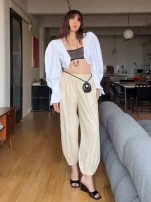 Another round of dressing inspired by the Chloé runway. I've really embraced more of my soft, bohemian side this summer, and it feels so natural to be in flowing genie pants and pieces fuller to the brim with romance. Soft feels daring today. #grwm #OOTD #styling #fashion                                          #cuup sheer bralette Mi Magic Love top  @asos pants (on sale)  Necklace I made  Ming Yu Wang ring  @St. Agni necklace worn as a belt  AGL wedges